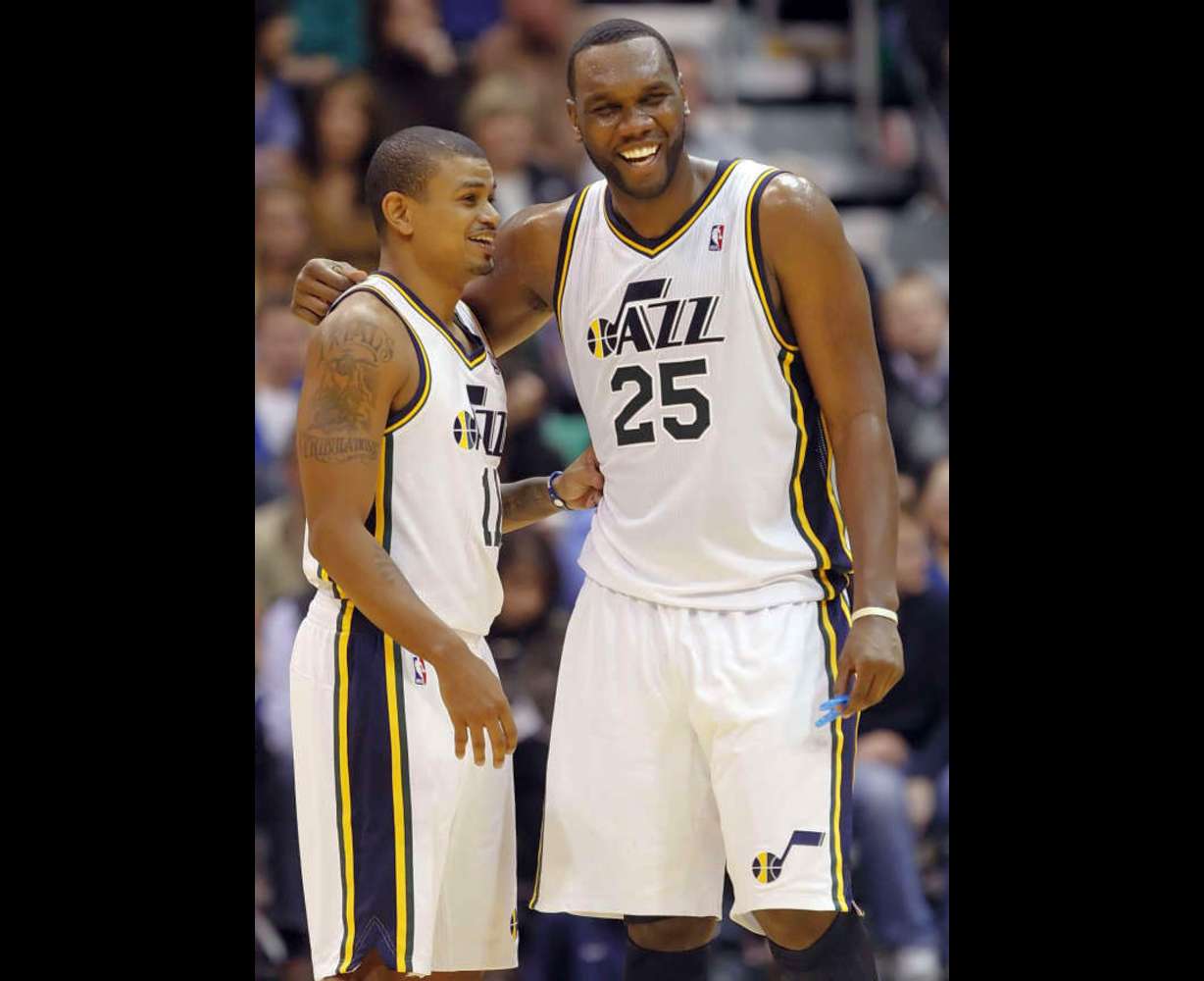 Utah Jazz point guard Earl Watson (11), left, and Utah Jazz center Al Jefferson (25) laugh after a play as the Utah Jazz and the Milwaukee Bucks play Tuesday, Jan. 3, 2012 at Energy Solutions Arena in Salt Lake City. The Jazz won 85-73. (Scott G Winterton, Deseret News)