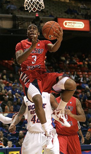Fresno State's Kevin Olekaibe (3) goes up for a 
shot against Boise State. (AP Photo/Matt 
Cilley)
