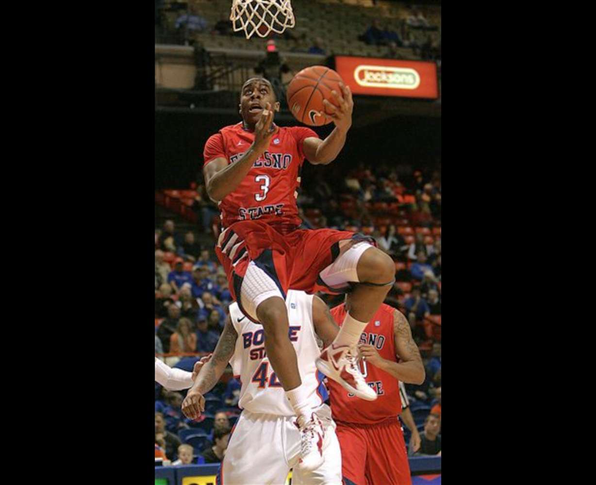 Fresno State's Kevin Olekaibe (3) goes up for a
shot against Boise State. (AP Photo/Matt
Cilley)