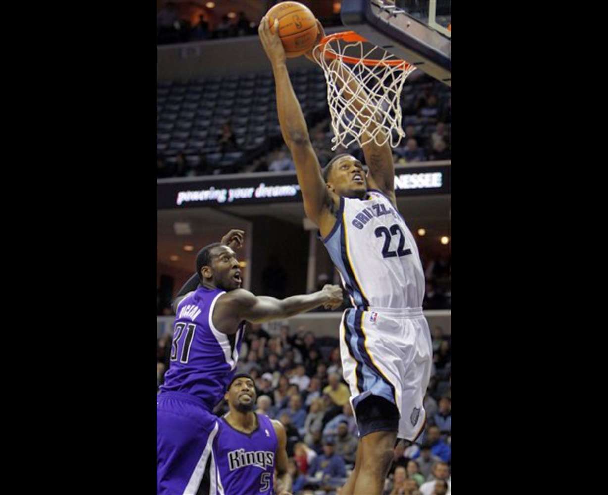 Memphis Grizzlies forward Rudy Gay (22) dunks
over Sacramento Kings forward J.J. Hickson (31)
in the first half of an NBA basketball game on
Tuesday, Jan. 3, 2012, in Memphis, Tenn. (AP
Photo/Jim Weber)
