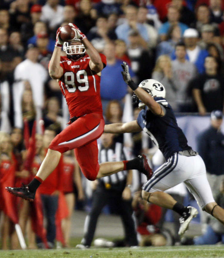 Utah Utes tight end Dallin Rogers (89) makes a reception for a first down with Brigham Young Cougars defensive back Daniel Sorensen defending as BYU and Utah play Saturday, Sept. 17, 2011 (Scott G Winerton, Deseret News)