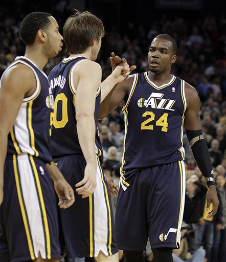 Utah Jazz's Paul Millsap (24) celebrates with
Gordon Hayward in the final minutes against the
Golden State Warriors. (AP Photo/Ben Margot)