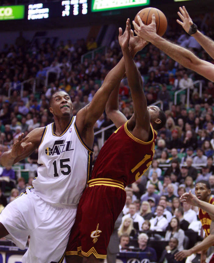 Utah Jazz forward Derrick Favors (15) battles for a rebound with Cleveland Cavaliers forward Tristan Thompson (13) as the Utah Jazz and the Cleveland Cavaliers play Tuesday, Jan. 10, 2012 at Energy Solutions Arena (Scott G Winterton, Deseret News)