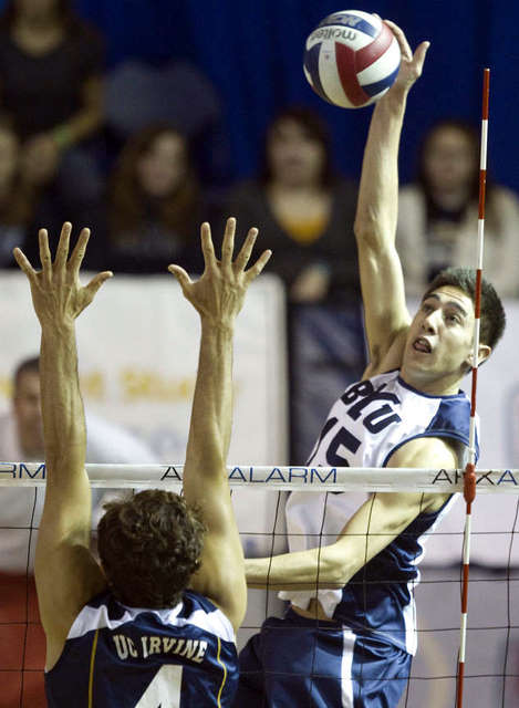 BYU's Taylor Sander spikes the ball down onto
UC Irvine. (Mike Terry, Deseret News)