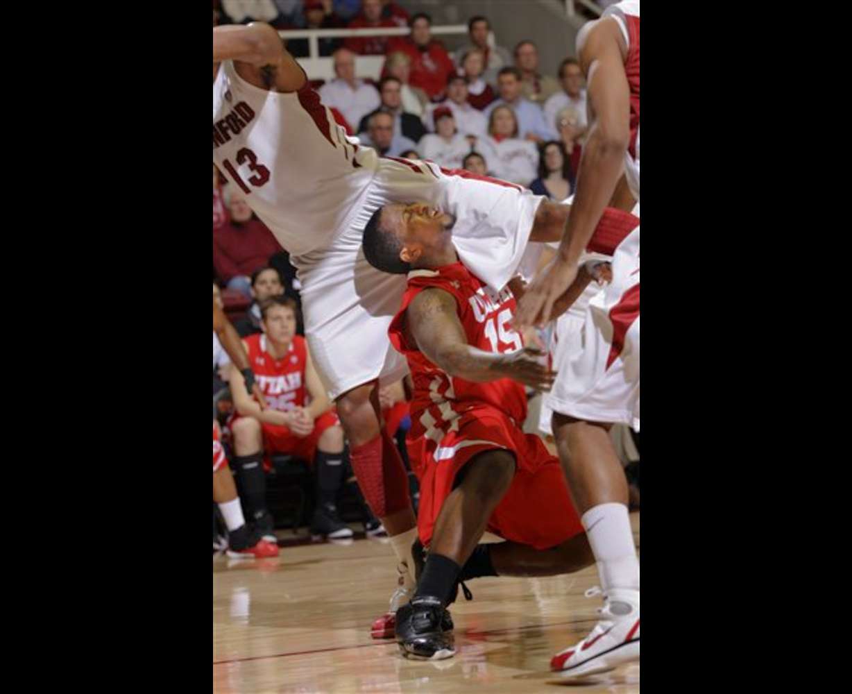 Utah guard Josh Watkins (15) collides with
Stanford forward Josh Owens (13). Stanford
defeated Utah 68-65. (AP Photo/Paul Sakuma)
