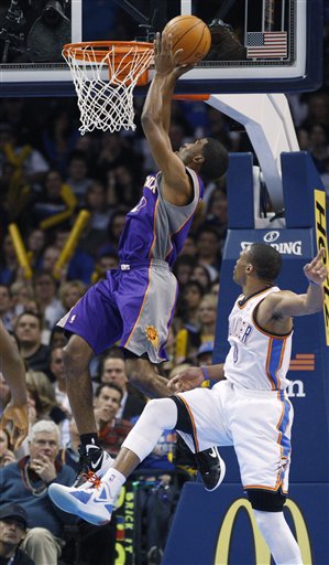 Phoenix Suns guard Ronnie Price, left, shoots 
in front of Oklahoma City Thunder guard Russell 
Westbrook. (AP Photo/Sue Ogrocki)