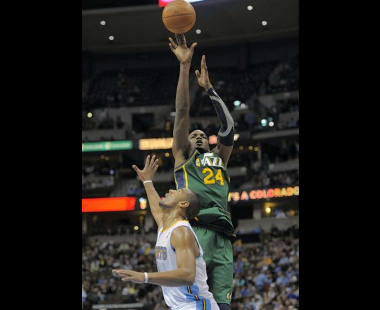 Utah Jazz forward Paul Millsap (24) shoots over
Denver Nuggets guard Arron Afflalo (6). Utah
beat Denver 106-96. (AP Photo/Jack Dempsey)
