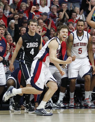 St. Mary's guard Matthew Dellavedova (4)
celebrates after making a 3-point shot against
Gonzaga. (AP Photo/Tony Avelar)