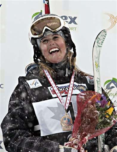 FILE - In this March 17, 2006, file photo, Sarah Burke of Canada, smiles as she celebrates her gold medal in the halfpipe FIS world Cup event. (AP Photo/The Canadian Press, Jacques Boissinot)