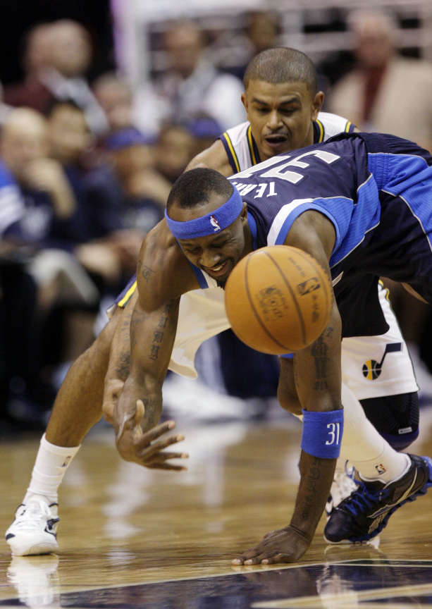 Utah Jazz point guard Earl Watson (11) steals the ball from Dallas Mavericks shooting guard Jason Terry (31) in Salt Lake City Thursday, Jan. 19, 2012. (Jeffrey D. Allred, Deseret News)