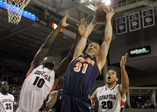 Pepperdine's Nikolas Skouen (31) pulls down a
rebound against Gonzaga. (AP Photo/Jed Conklin)