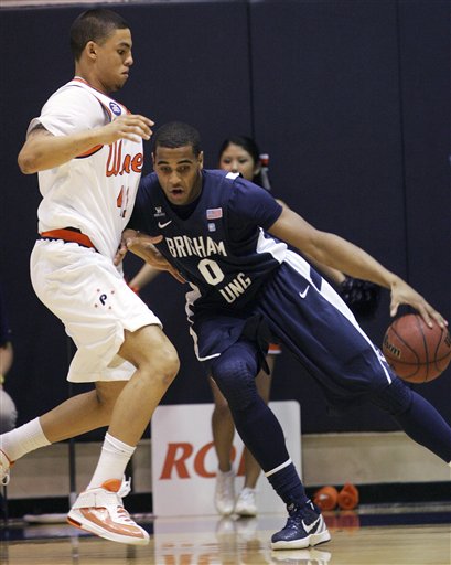 BYU's Brandon Davies (0) backs down
Pepperdines's Taylor Darby. (AP Photo/Ringo
H.W. Chiu)