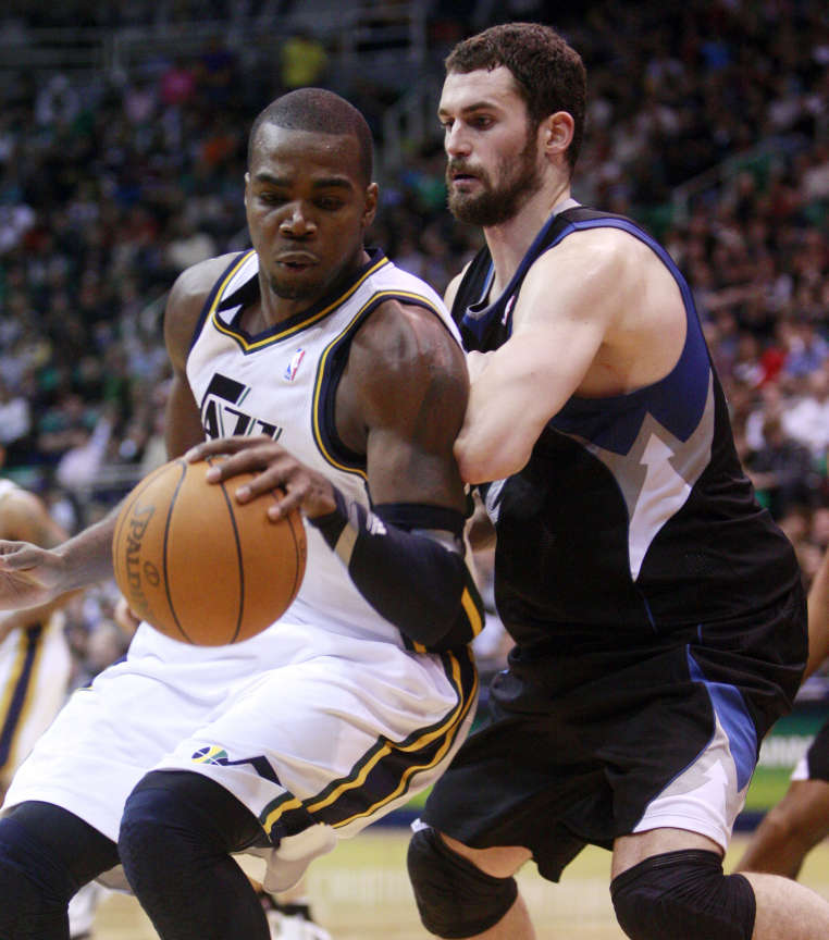 Utah Jazz forward Paul Millsap (24) works on Minnesota Timberwolves power forward Kevin Love (42) as the Utah Jazz and the Minnesota Timberwolves play Saturday, Jan. 21, 2012 in Energy Solutions arena in Salt Lake City. Jazz won 108-98. (Scott G Winterton, Deseret News)