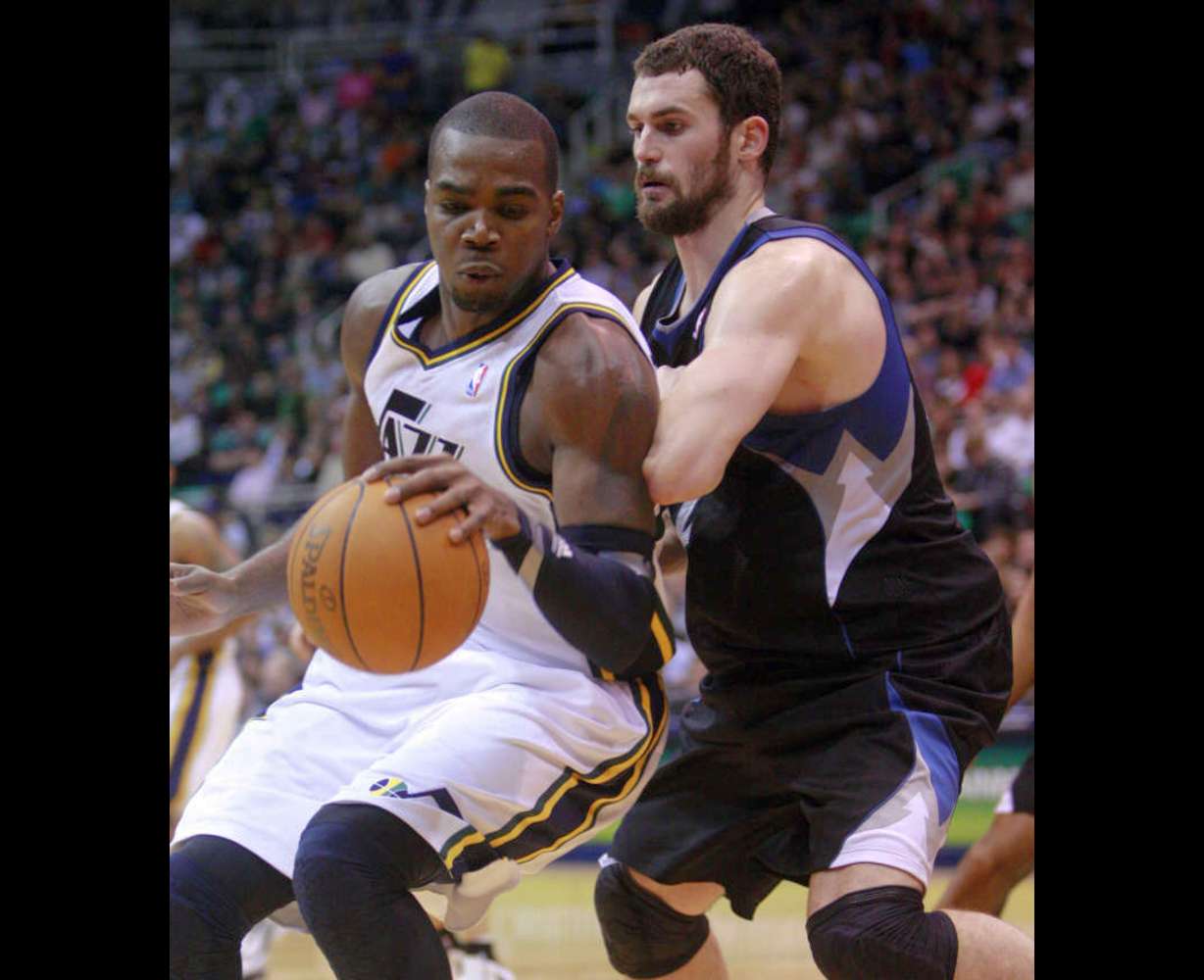 Utah Jazz forward Paul Millsap (24) works on Minnesota Timberwolves power forward Kevin Love (42) as the Utah Jazz and the Minnesota Timberwolves play Saturday, Jan. 21, 2012 in Energy Solutions arena in Salt Lake City. Jazz won 108-98. (Scott G Winterton, Deseret News)