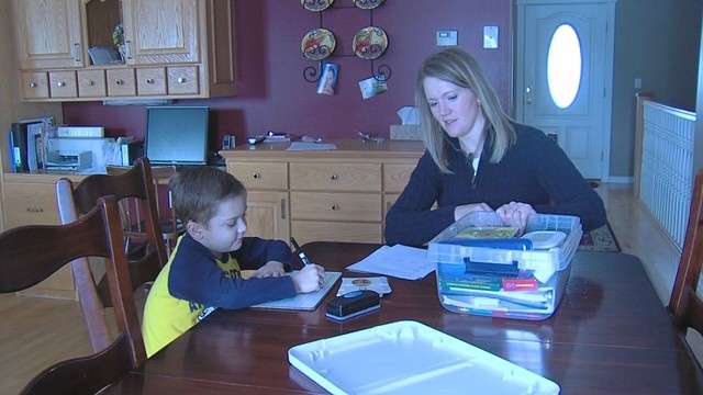 Spencer Felt's mother, Nancy Felt, teaches him from home while he continues to recover.