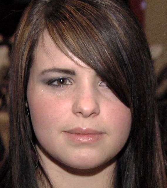 Natalie Knudson left Colorado City at age 17,
but only after her father forced her to get
married. She's now divorced and getting help
from the Holding Out Help group.