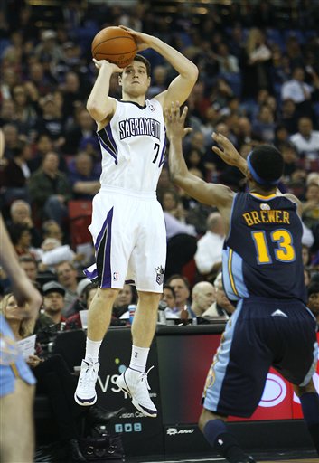Sacramento Kings guard Jimmer Fredette (7) 
shoots in front of Denver Nuggets defender 
Corey Brewer (13).(AP Photo/Steve Yeater)