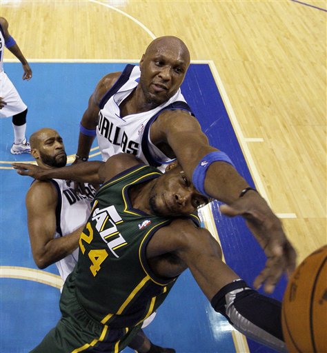Dallas Mavericks' Lamar Odom, top, reaches over 
Utah Jazz's Paul Millsap (24) while competing 
for a rebound. The Mavericks won 116-101. (AP 
Photo/Tony Gutierrez)