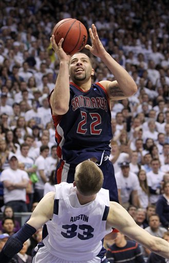 Saint Mary's forward Rob Jones (22) attempts to
score against BYU center Nate Austin (33). (AP
Photo/Colin E Braley)