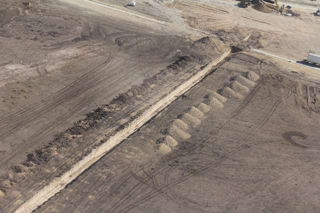 FLDS workers excavated a trench in solid rock and buried two pipes, roughly 48 inches in diameter. They encircle the building and run, side by side, hundreds of yards to the west. (Photo courtesy Eldorado Success)
