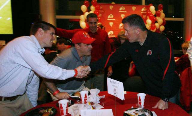 Kyle Whittingham, right, greets Richard
Folkerson at the Utah football national letter
of intent Crimson Club celebration. (Deseret
News)