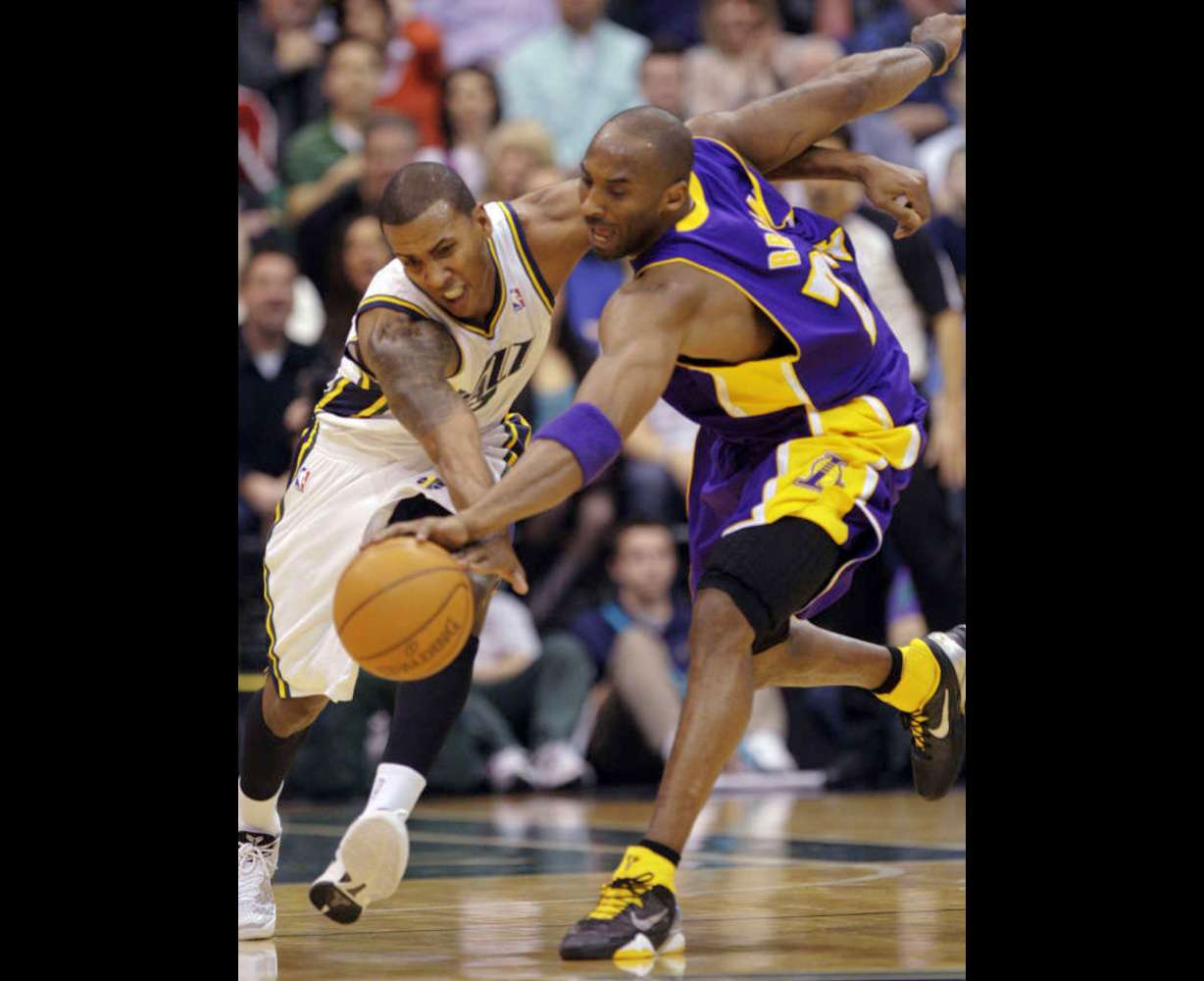 Utah Jazz shooting guard Raja Bell (19) and Los Angeles Lakers shooting guard Kobe Bryant (24) fight for the ball in Salt Lake City Saturday, Feb. 4, 2012. (Jeffrey D. Allred, Deseret News)
