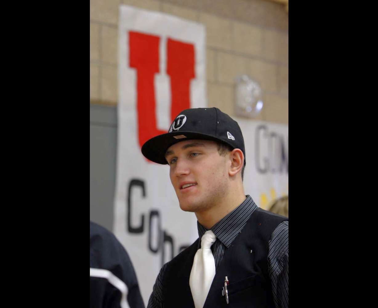 Chase Hansen chats with well-wishers after signing his letter of intent at Lone Peak High School on Wednesday, February 1, 2012. Hansen will be playing football at the University of Utah. (Laura Seitz, Deseret News)