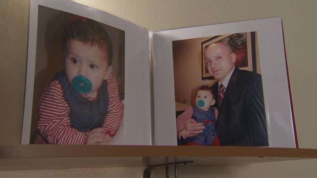 Photos of Robert Manzanares and his daughter, Baby B, taken at a court hearing a couple of years ago when he was allowed to hold the girl.