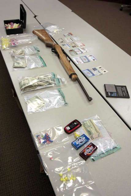 Evidence on display from a drug bust including
fake ID's. (Jason Olson, Deseret News)