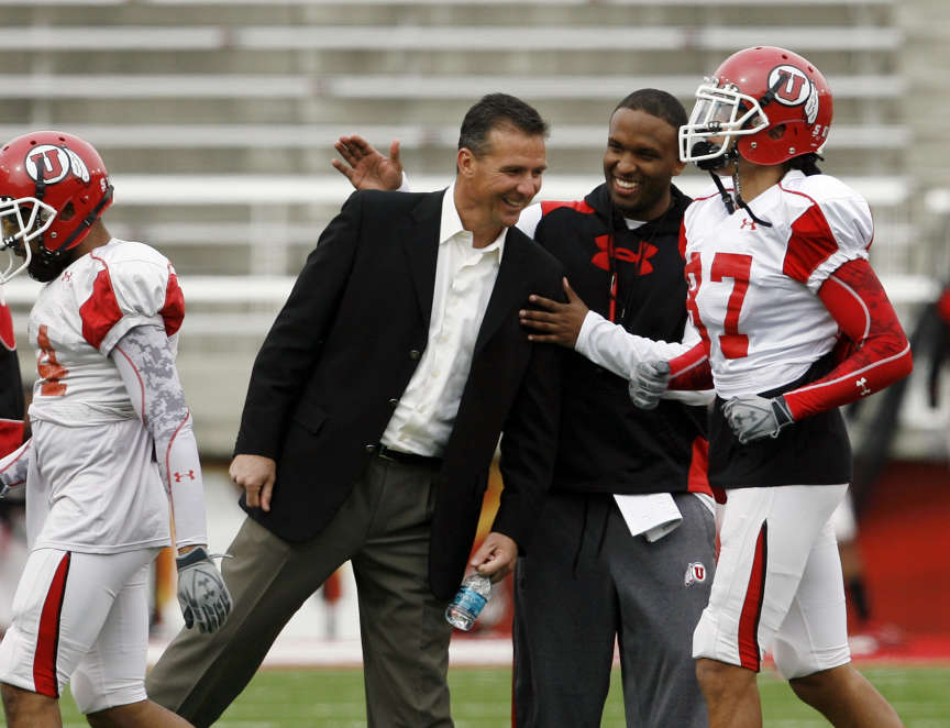 Former Utah football coach Urban Meyer talks with Utah quarterbacks coach Brian Johnson during University of Utah football practice at Rice Eccles Stadium in Salt Lake City, Utah, Thursday, March 17, 2011. (Ravell Call, Deseret News)