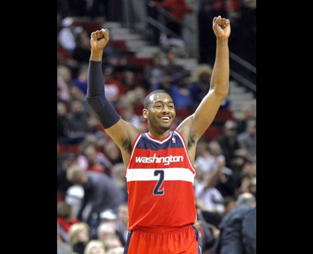 Washington Wizards guard John Wall celebrates
after their NBA basketball game against the
Portland Trail Blazers in Portland, Ore.,
Tuesday, Feb. 14, 2012. Wall scored 29 points
as they beat the Blazers 124-109.(AP Photo/Don
Ryan)