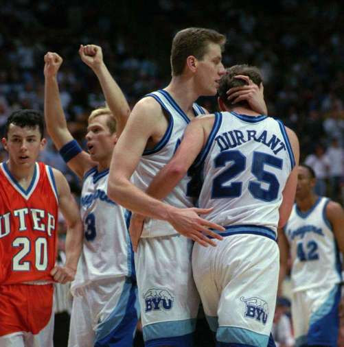 Russell Larson hugs Mark Durrant. (Gary
McKellar, Deseret News)