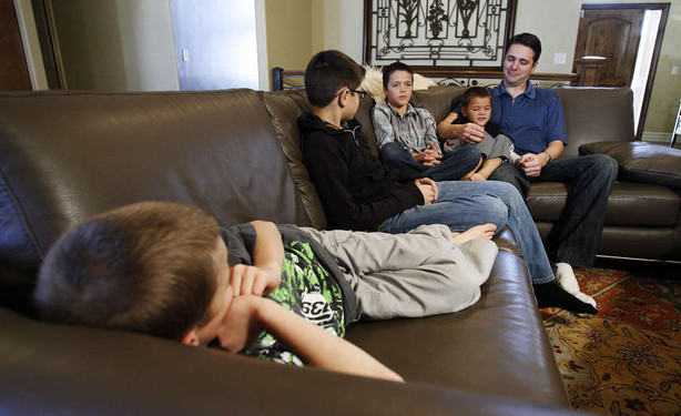 Grant Durtschi, right, is interviewed along with his boys, in Draper, Monday, Feb. 20, 2012. Durtschi spent thousands of dollars trying to get custody of his sons. several bills this session will affect people like him.