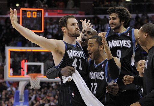 Minnesota Timberwolves forward Kevin Love
(42) reacts with guard Wayne Ellington (22)
and guard Ricky Rubio (9) after
hitting a three point shot to win the game
against the Los Angeles
Clippers. (AP Photo/Mark J. Terrill)