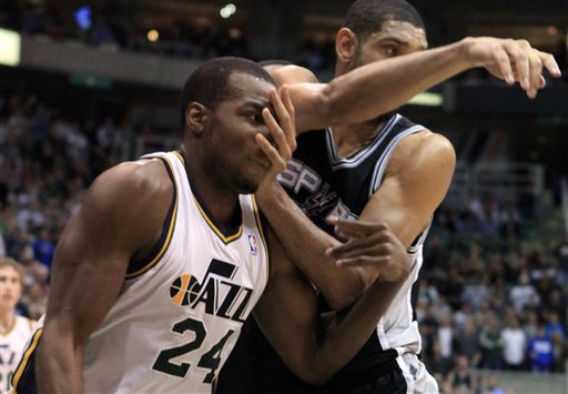 Utah Jazz forward Paul Millsap (24) and San
Antonio Spurs center Tim Duncan (21) jockey for
position. The Spurs won 106-102. (AP Photo/Jim
Urquhart)