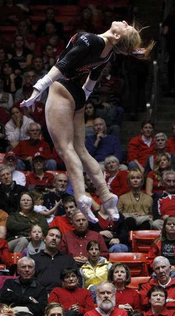 Cortni Beers of Utah performs on the bars as the University of Utah and Stanford meet in NCAA gymnastics in Salt Lake City, Friday, Feb. 24, 2012. (Ravell Call, Deseret News)