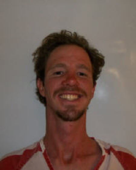 Man arrested for allegedly shooting motel room neighbor