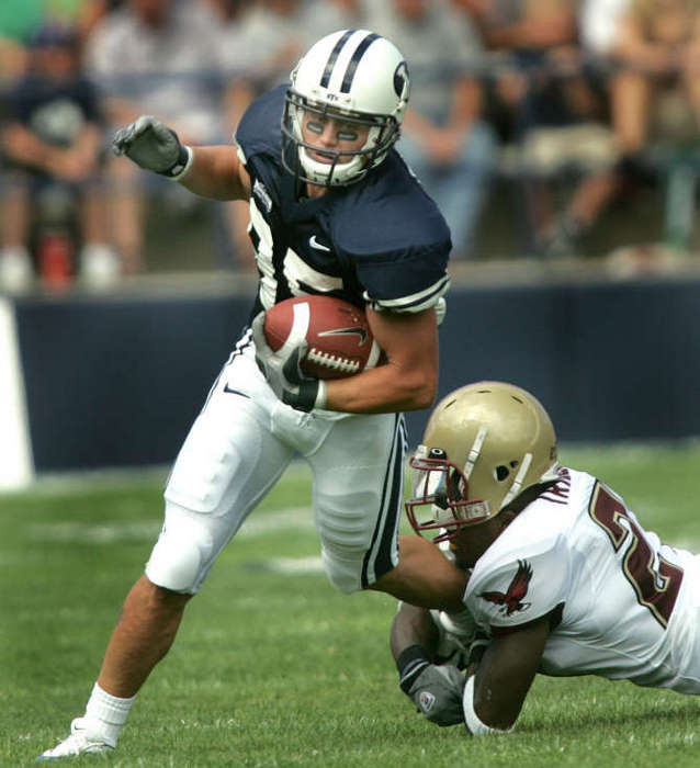 Zac Collie breaks a tackle against Boston
College, Sept. 3, 2005 (Stuart Johnson/Deseret
News)