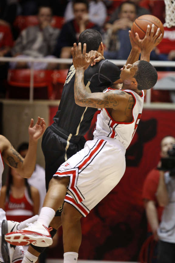 Utah's Kareem Storey fouls CU's Andre Roberson as the University of Utah plays Colorado in Pac-12 basketball Saturday, Feb. 18, 2012, in Salt Lake City Utah. (Tom Smart, Deseret News)