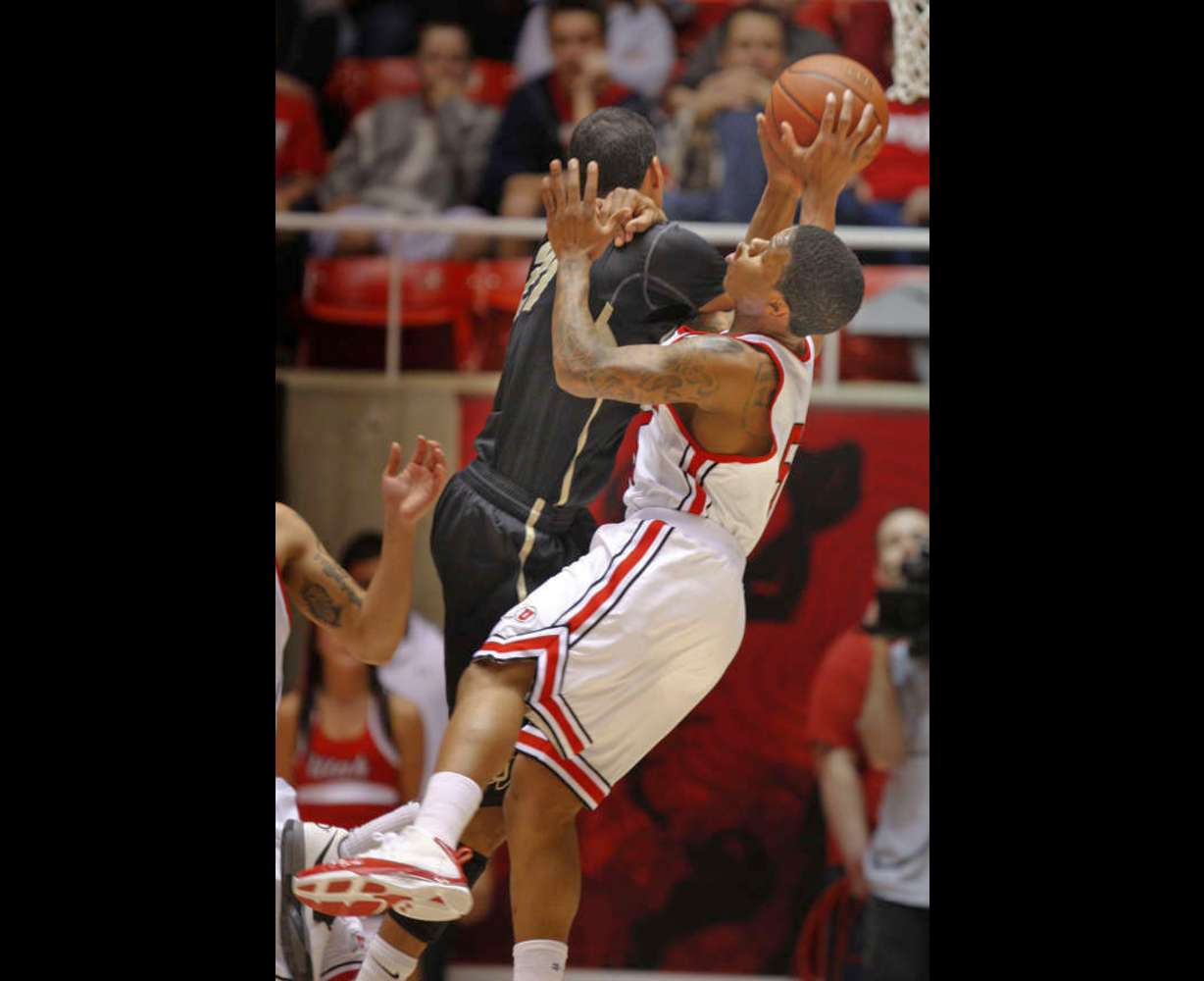 Utah's Kareem Storey fouls CU's Andre Roberson as the University of Utah plays Colorado in Pac-12 basketball Saturday, Feb. 18, 2012, in Salt Lake City Utah. (Tom Smart, Deseret News)
