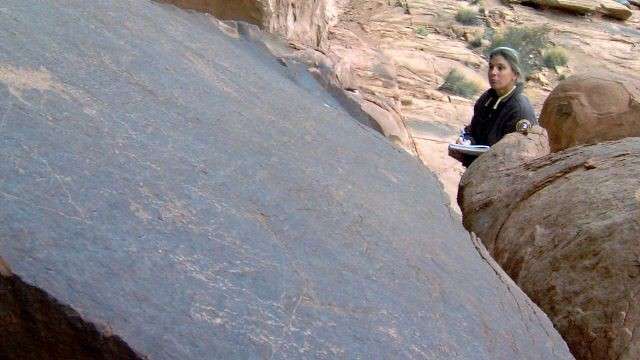 As Joette Langianese hikes through Arches National Park, she inspects rock art from a distance, takes careful notes and photos, and records what's happening to this special place over time. It's part of her volunteer work with Friends of Arches & Canyonlands National Parks.