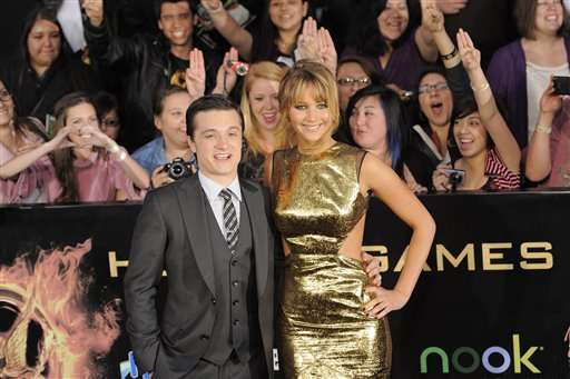 Josh Hutcherson, left, and Jennifer Lawrence arrive at the world premiere of "The Hunger Games" on Monday March 12, 2012 in Los Angeles. (AP Photo/Chris Pizzello)