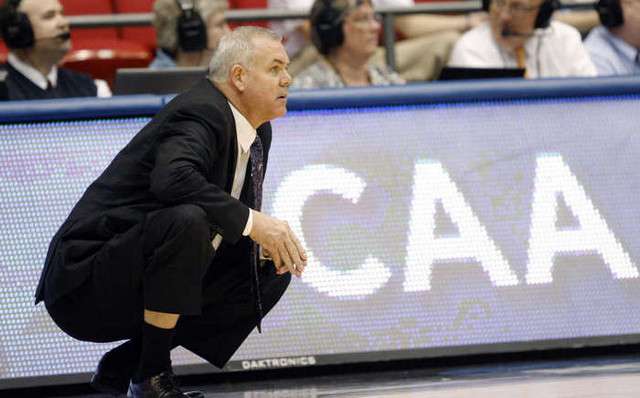 BYU head coach Dave Rose kneels during the
Cougars' game against Iona. (Stuart
Johnson/Deseret News)