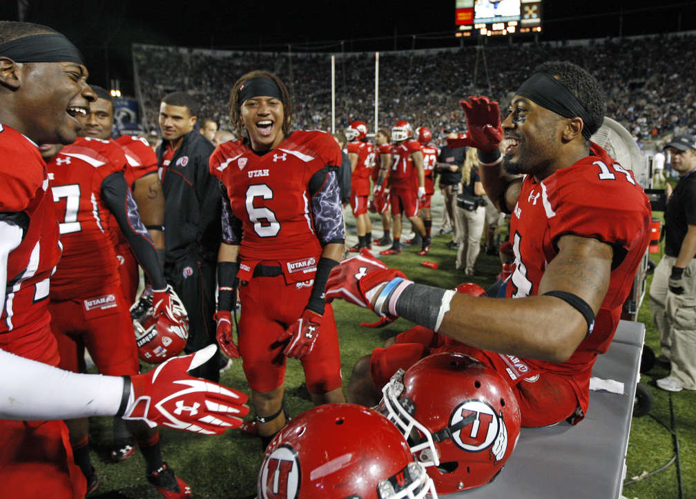 Utah Utes wide receiver DeVonte Christopher (10), Dres Anderson (6) and Reggie Dunn (14) , from left, celebrate as the University of Utah defeats BYU 54-10 in Provo (Tom Smart, Deseret News)