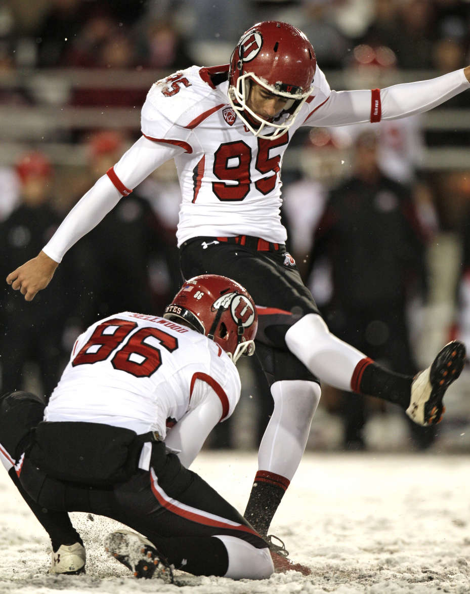 Utah kicker Coleman Petersen (95) hits a 33-yard field goal from the hold of Sean Sellwood (86) during the third quarter of an NCAA College football game against Washington State Saturday, Nov. 19, 2011, in Pullman Wash. Utah won 30-27 in overtime. (AP Photo/Dean Hare)