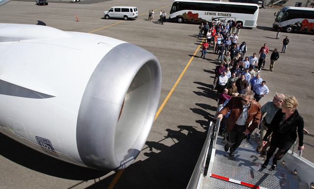 Visitors tour a Boeing 787 in Salt Lake City, Thursday, March 15, 2012.