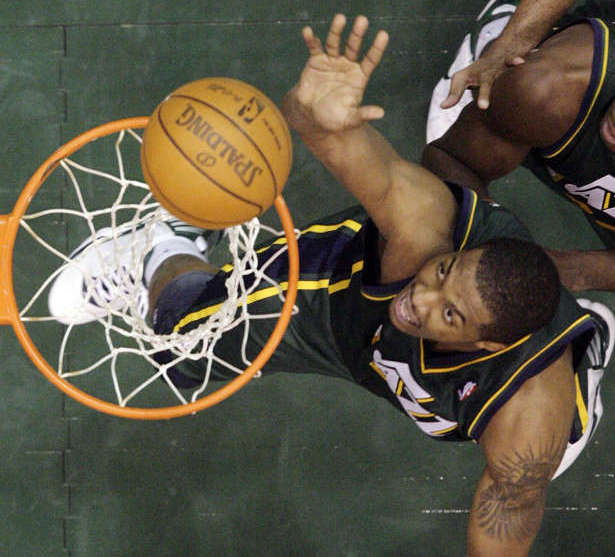 Utah Jazz forwardcenter Derrick Favors (15) 
tips in the ball against the Golden State 
Warriors. (Jeffrey D. Allred/Deseret News)