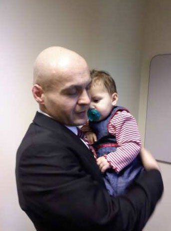 Robert Manzanares with his child, Baby B, during the only time he has been allowed to see and hold her.