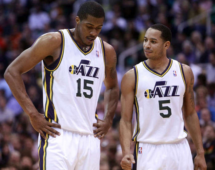 Utah Jazz guard Devin Harris (5) tries to 
encourage teammate Utah Jazz forward Derrick 
Favors (15) at the free throw line. (Scott G. 
Winterton/Deseret News)