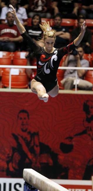 Mary Beth Lofgren of Utah performs on the beam during the Pac-12 gymnastics championships at the Huntsman Center in Salt Lake City, Saturday, March 24, 2012. (Ravell Call, Deseret News)